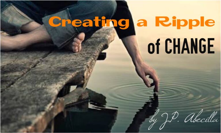 man touching the water to create a ripple