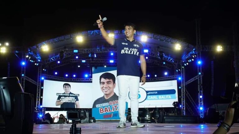 carl balita waving on stage